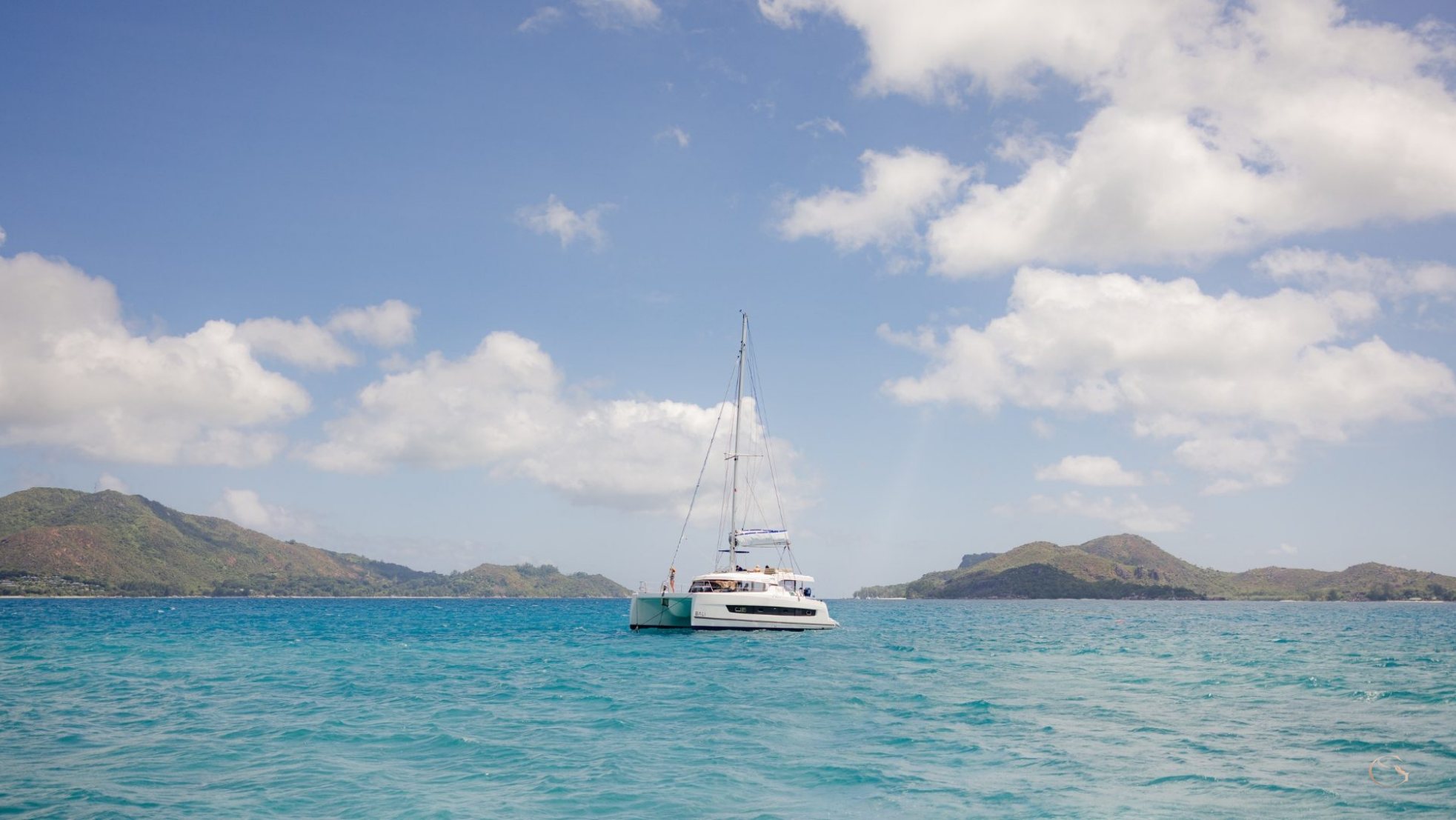 Catamaran sailing off Praslin, Seychelles LuxurySafariLodges.com