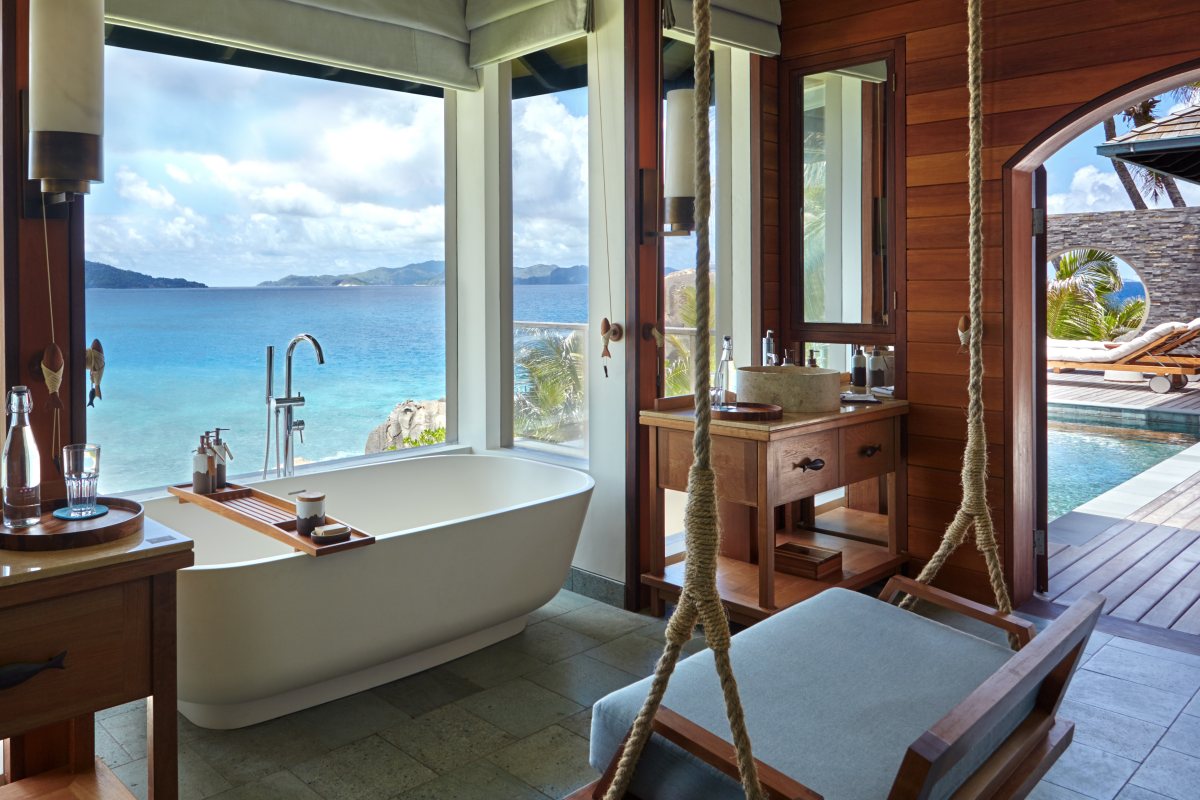 Oceanfront Pool Villa bathroom with a view of the islands at Six Senses Zil Pasyon