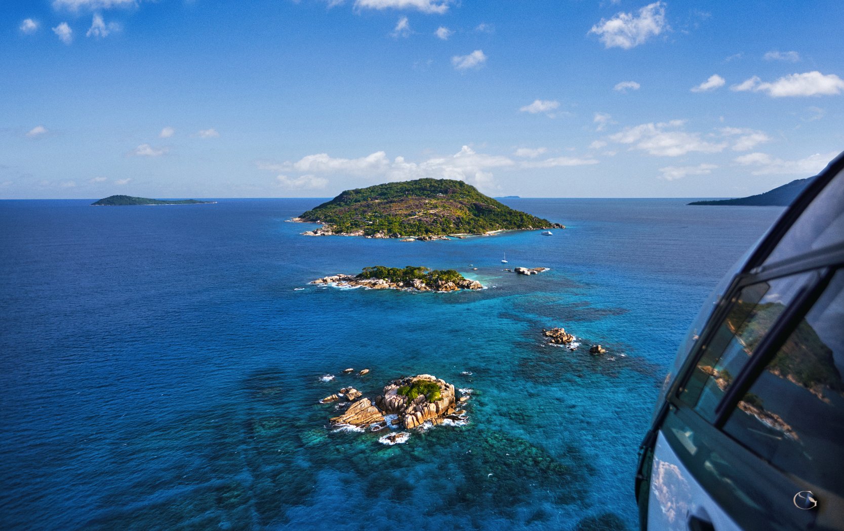 Helicopter view over the islands near Félicité, Seychelles LuxurySafariLodges.com