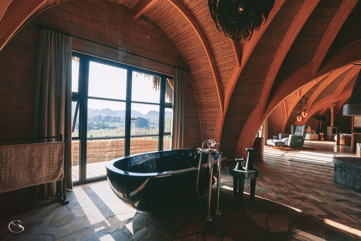 Opulent bath with mountain views at Bisate Reserve